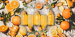 Immune boosting turmeric, ginger, citrus juice shot in bottles