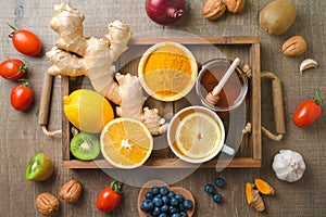 Immunity boosters fruits and vegetables on wooden table. Health care background concept. Top view, flat lay