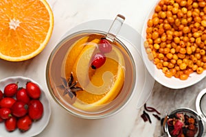 Immunity boosting drink and ingredients on white marble table, flat lay