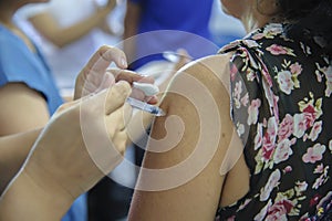 Immunization vaccine injection , doctor inject vaccine to patient arm