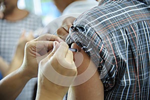 immunization vaccine injection , doctor inject vaccine to patient arm photo