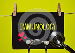 IMMUNOLOGY on top of yellow background photo