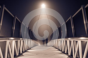 Misty bridge at night