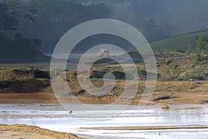 The impact of climate change, made dry land, water shortages. Lonely small house between rivers dry part 2