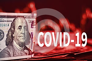 Impact of coronavirus COVID-19 on global economy, financial crisis. USD dollar bills with market price charts and inscription