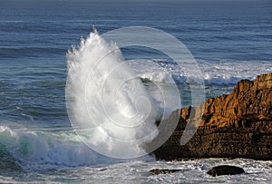 Impact of large wave against rocks