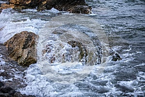 Impact of large waves against rocks