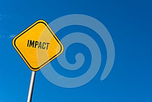 Impact - yellow sign with blue sky