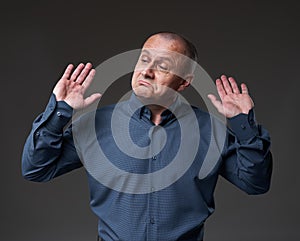 Impartial businessman on gray background