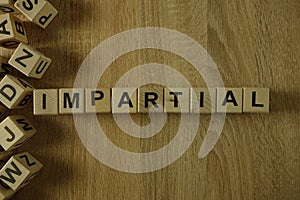 Impartial word from wooden blocks photo