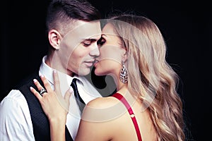 Impassioned couple. handsome businesslike men with beautiful girl with long blond hair photo