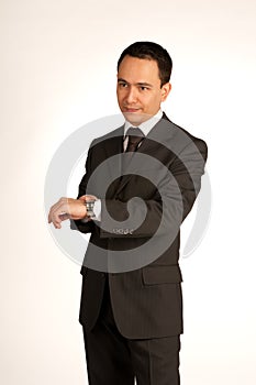 Impatient businessman pointing at watch photo