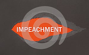 IMPEACHMENT - appearing behind torn paper