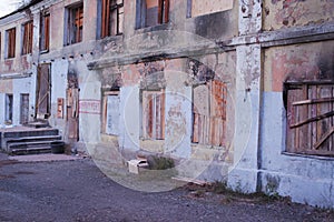 Impeachment graffito on the wall of an ugly old house