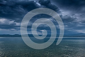 An impending cyclone with thunderstorms and squally winds on the lake photo