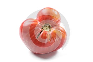 Imperfect big red heirloom tomato isolated
