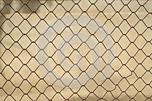 imperfect rusty wire mesh fence. concept of prohibited freedom. wallpaper textures