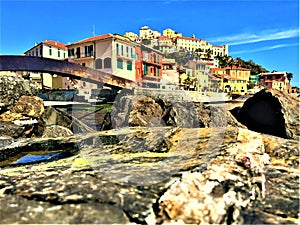 Imperia city, Liguria region, Italy. Sea, colourful houses, , bridge, rocks and touristic attraction