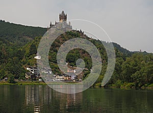 Perched high on the hill over the Moselle River in the picturesque town of Cochem is the beautiful Reichsburg Cochem Castle. photo
