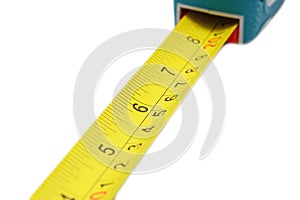 Imperial and metric scale on a measuring tape ruller