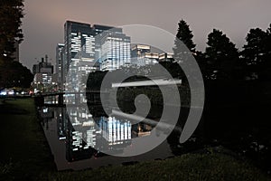 Imperial palace in Tokyo in front of the cityscape at night