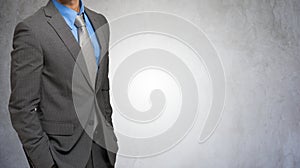 Impersonal portrait of a businessman against a grey background photo