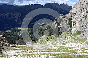 impervious serpentine path in the Alps mountains with a zigzag p