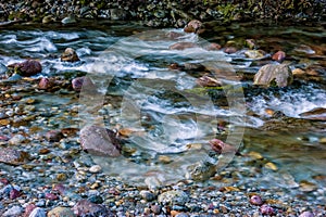 The impetuous waters of a mountain stream photo