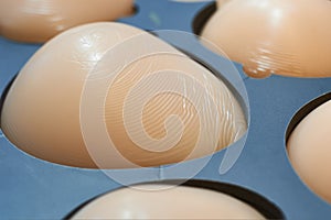Implant imitators for fitting and selecting breast size, choice before endoprosthetics. In the cells are examples of different
