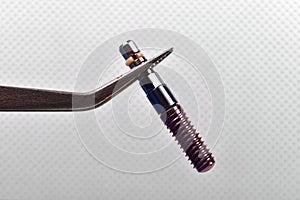 Implant in tweezers