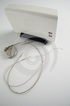 An Implantable Cardioverter Defibrillator or ICD pacemaker with leads and modem for telemonitoring at home. The device sends data photo