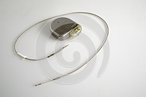 An Implantable Cardioverter Defibrillator or ICD pacemaker with leads. This is placed in the chest to prevent suddent death when photo