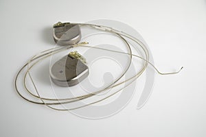 An Implantable Cardioverter Defibrillator or ICD pacemaker with leads. This is placed in the chest to prevent suddent death when