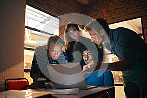 Implement technological solutions to make your business more efficient. Shot of a group of designers working together on