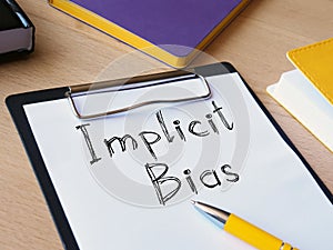 Implicit bias is shown on the conceptual photo using the text