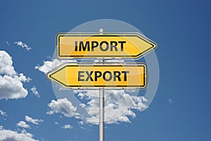 Import export buttons onyellow arrows in front of blue sky - trade