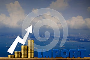 IMPORT text and stack of coin on wood table over seascape and ca