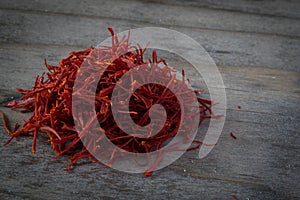 Imported Persian Saffron on a wooden table photo
