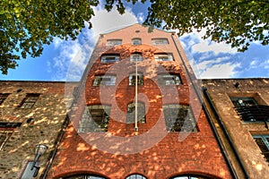 Imposing brick building rises into sky photo