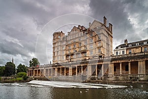 An imposing building over the river Avon in Bath, England