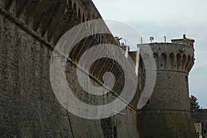 View of the walls and one of the towers of the Medici Fortress in Volterra photo
