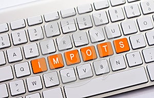 IMPOTS writing on white keyboard