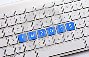 IMPOTS writing on white keyboard