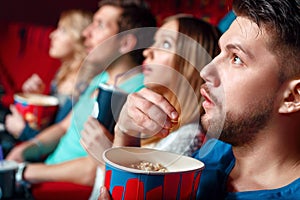 Impressed cinema viewers with popcorn