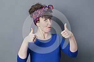 Impressed woman with thumbs up for cool happiness