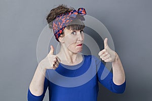 Impressed woman with thumbs up for cool happiness photo