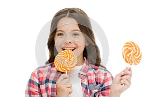 Impressing fact sugar nutrition. Girl child smiling holds lollipop candy. Girl kid with lollipop looks happy. Healthy