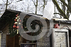 Impressions from the Christmas market with decorated wooden stalls with colorful balls