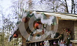 Impressions from the Christmas market with decorated wooden stalls with colorful balls