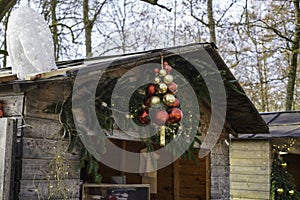 Impressions from the Christmas market with decorated wooden stalls with colorful balls